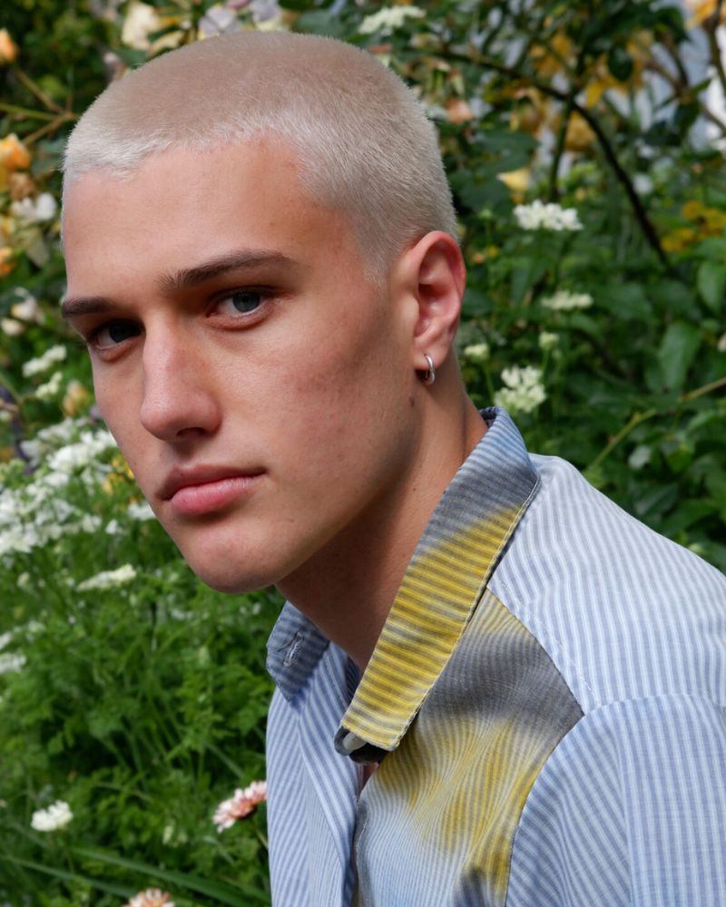 model at NZFW Ollie Burgess Gooch in a blue and yellow shirt